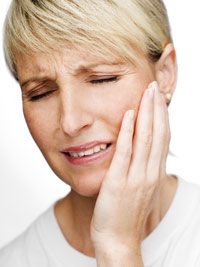 Woman suffering from TMJ pain